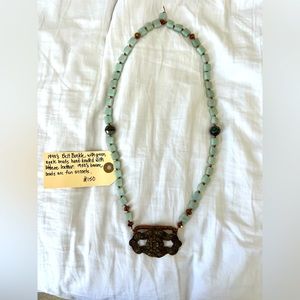 Vintage necklace.Hand knotted leather with 1940s buckle.Private label Cara Brown